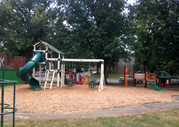 Kids and parents love our fenced outdoor Playgrounds!